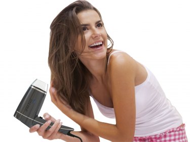 beatyful girl with hair dryer