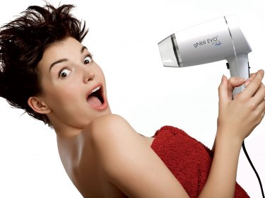 girl with hair dryer for hotel